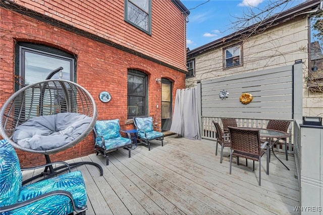 wooden deck with outdoor dining area