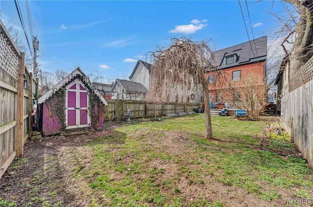 view of yard with a storage shed and an outdoor structure