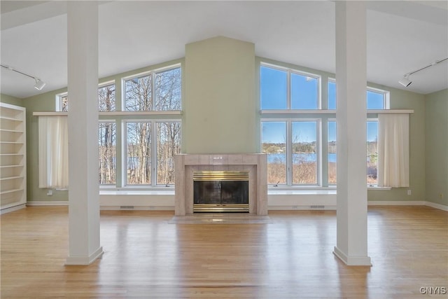 3158 W Lake Rd, Cazenovia, NY 13035 - unfurnished living room featuring track lighting and wood finished floors