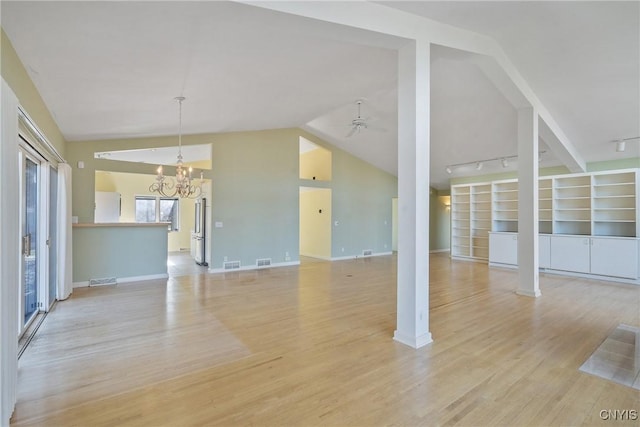 3158 W Lake Rd, Cazenovia, NY 13035 - unfurnished living room with light wood-type flooring, visible vents, baseboards, and vaulted ceiling