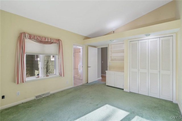 3158 W Lake Rd, Cazenovia, NY 13035 - unfurnished bedroom featuring ensuite bathroom, visible vents, lofted ceiling, and carpet