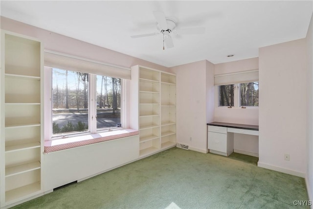 3158 W Lake Rd, Cazenovia, NY 13035 - unfurnished bedroom with built in desk, light colored carpet, and baseboards