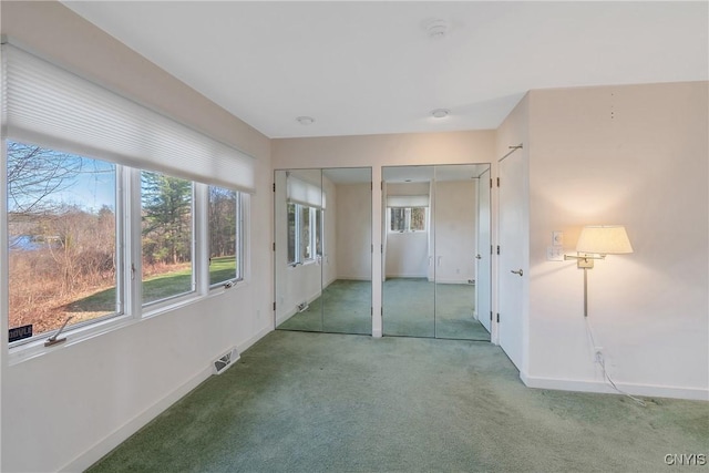 3158 W Lake Rd, Cazenovia, NY 13035 - carpeted empty room with visible vents and baseboards