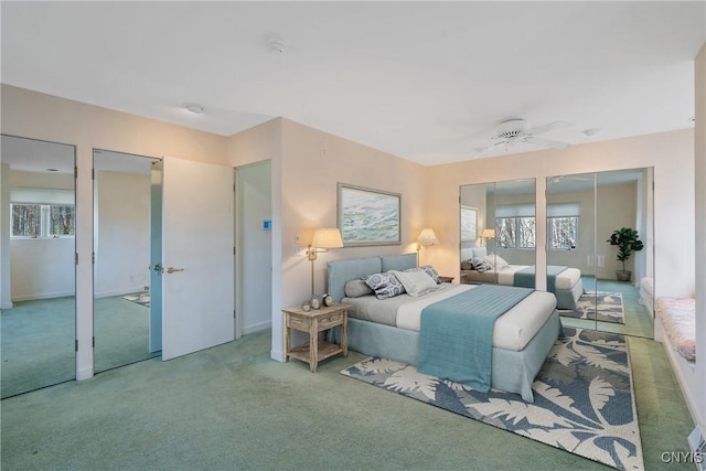 3158 W Lake Rd, Cazenovia, NY 13035 - bedroom with carpet, multiple windows, and two closets