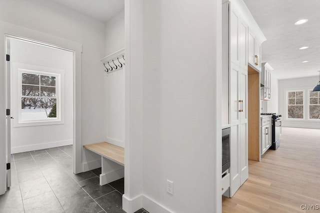 mudroom featuring baseboards and recessed lighting