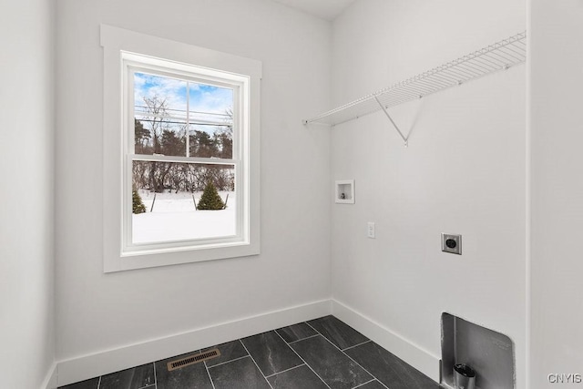 laundry area featuring washer hookup, hookup for an electric dryer, laundry area, visible vents, and baseboards
