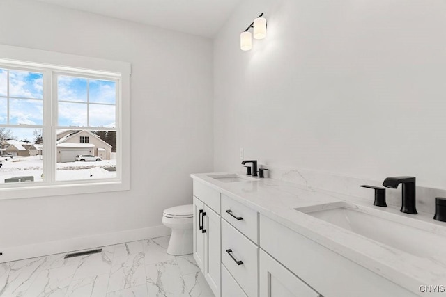 full bathroom featuring visible vents, marble finish floor, toilet, baseboards, and a sink