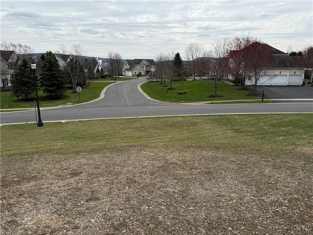 view of street featuring street lighting and a residential view