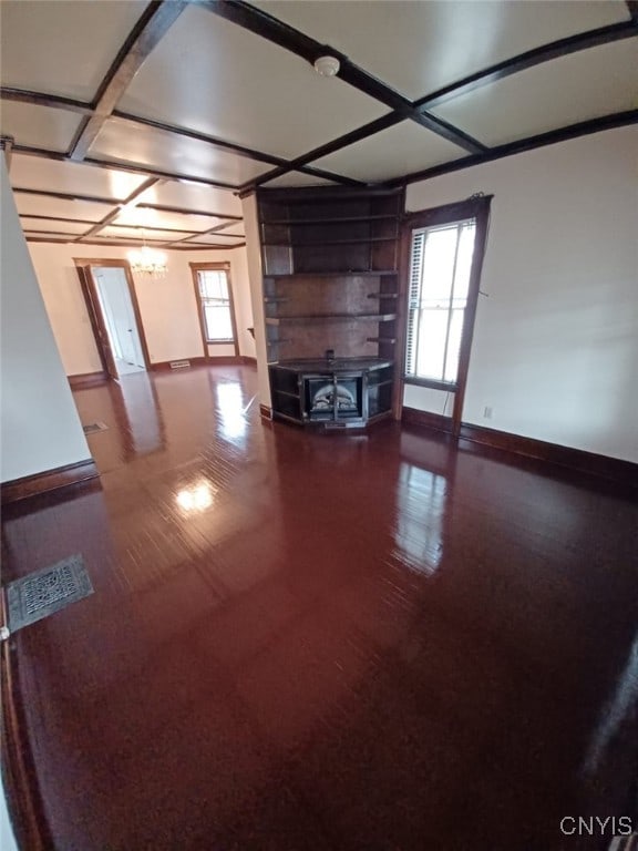 482 Roe Ave, Elmira-City, NY 14901 - unfurnished living room with a healthy amount of sunlight, baseboards, and coffered ceiling