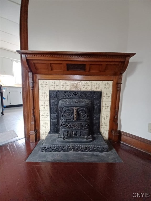 482 Roe Ave, Elmira-City, NY 14901 - details featuring wood finished floors, a fireplace, and baseboards