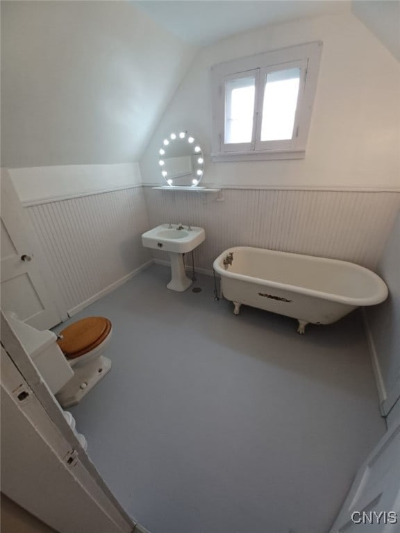 482 Roe Ave, Elmira-City, NY 14901 - full bathroom with a wainscoted wall, a soaking tub, and vaulted ceiling