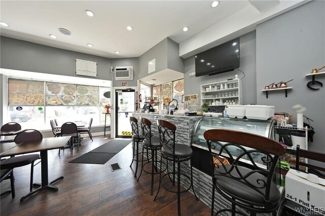 894 Tonawanda St, Buffalo, NY 14207 - kitchen featuring recessed lighting, dark wood-type flooring, visible vents, and a wall unit AC