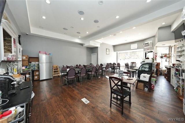894 Tonawanda St, Buffalo, NY 14207 - dining room featuring dark wood-type flooring, an AC wall unit, and recessed lighting