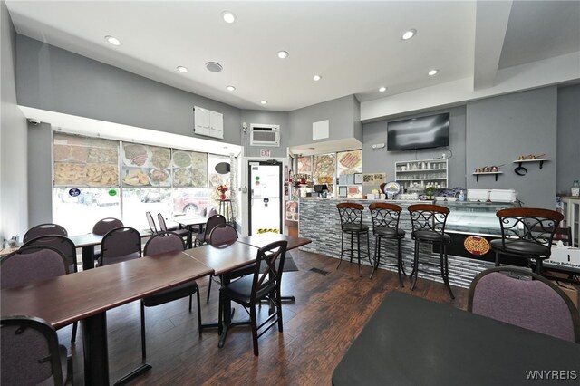 894 Tonawanda St, Buffalo, NY 14207 - dining room featuring wood finished floors, a wall mounted air conditioner, and recessed lighting