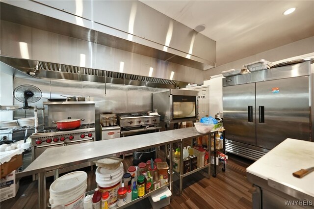 894 Tonawanda St, Buffalo, NY 14207 - kitchen featuring dark wood-style flooring, recessed lighting, light countertops, stainless steel built in fridge, and ventilation hood