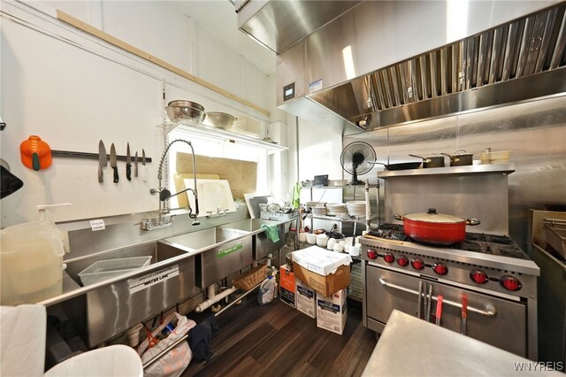 894 Tonawanda St, Buffalo, NY 14207 - kitchen with dark wood-type flooring, range hood, and double oven range