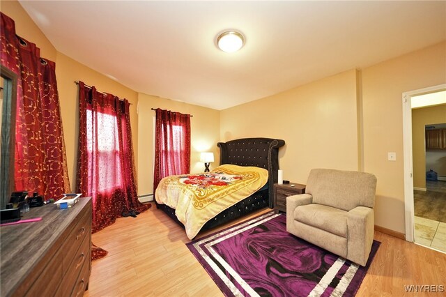 894 Tonawanda St, Buffalo, NY 14207 - bedroom featuring light wood finished floors and baseboard heating