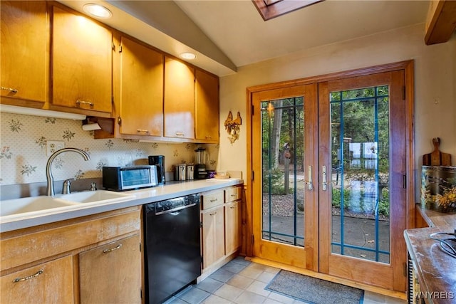 6634 Lake Shore Rd, Evans, NY 14047 - kitchen with black dishwasher, french doors, vaulted ceiling, light countertops, and light tile patterned floors