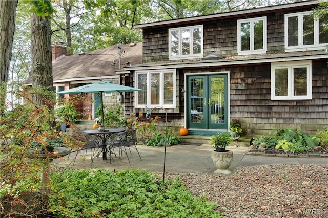 6634 Lake Shore Rd, Evans, NY 14047 - back of house with a patio area, french doors, a shingled roof, and a chimney