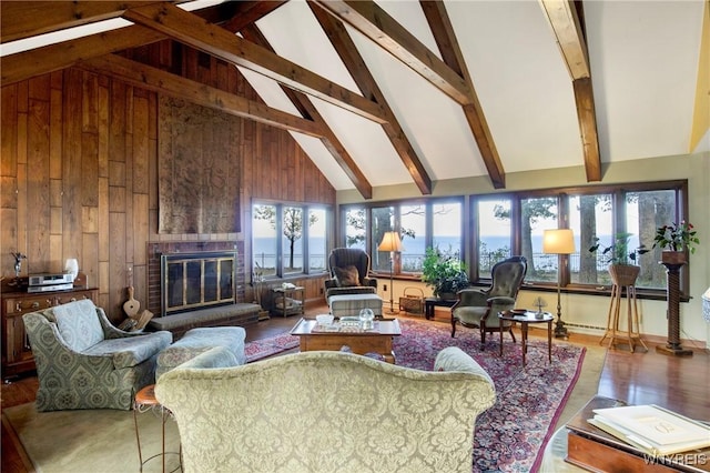 6634 Lake Shore Rd, Evans, NY 14047 - living room featuring healthy amount of natural light, high vaulted ceiling, beam ceiling, a brick fireplace, and wooden walls