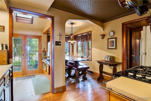 6634 Lake Shore Rd, Evans, NY 14047 - entrance foyer with plenty of natural light, wood finished floors, and arched walkways