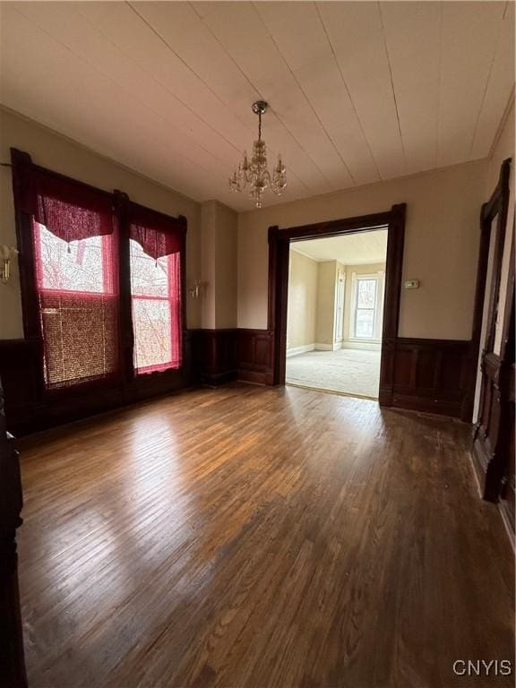620 Court St, Syracuse, NY 13208 - unfurnished dining area featuring plenty of natural light, a notable chandelier, and wainscoting