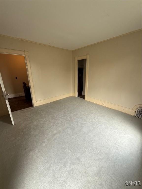 620 Court St, Syracuse, NY 13208 - carpeted empty room featuring baseboards