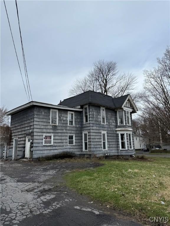 620 Court St, Syracuse, NY 13208 - exterior space with driveway and a lawn