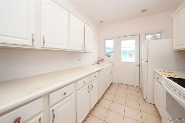 8784 Lake Shore Rd, Evans, NY 14006 - kitchen with white appliances, white cabinetry, light tile patterned flooring, and light countertops