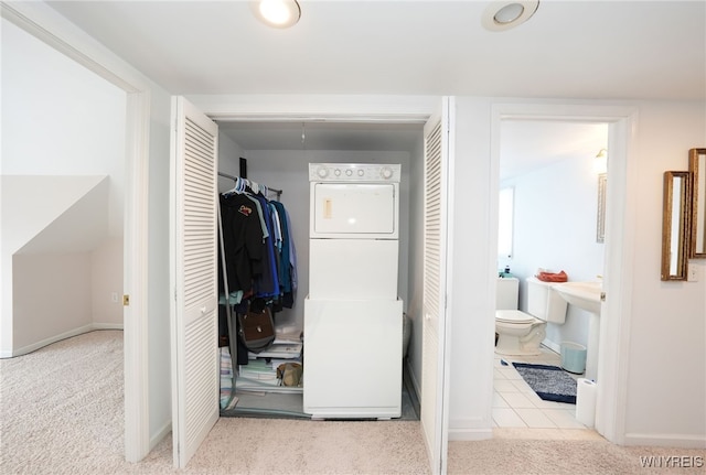 8784 Lake Shore Rd, Evans, NY 14006 - hall with stacked washer / drying machine, carpet floors, and baseboards