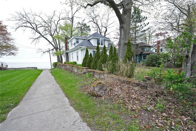 8784 Lake Shore Rd, Evans, NY 14006 - view of home's exterior with a chimney and a lawn