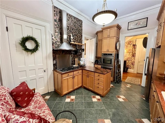 kitchen with stainless steel appliances, wall chimney exhaust hood, ornamental molding, and dark countertops