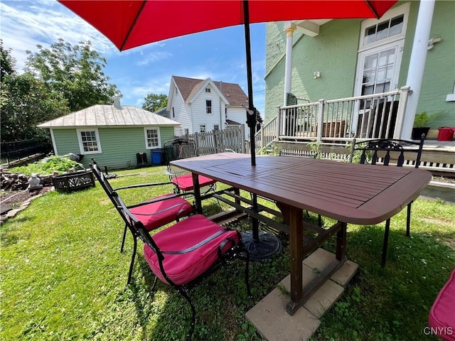 view of patio featuring an outbuilding