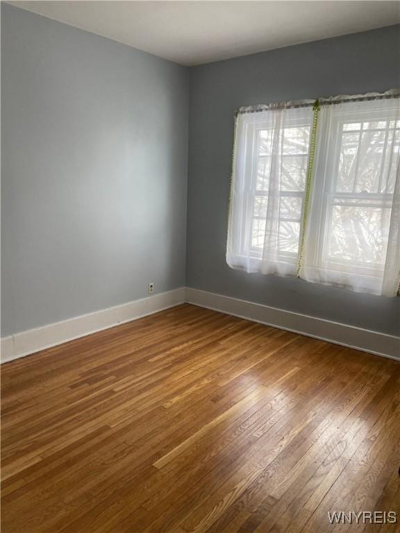 333 Colvin Ave, Buffalo, NY 14216 - empty room with baseboards and hardwood / wood-style flooring