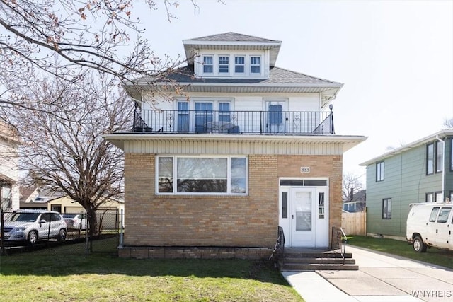 333 Colvin Ave, Buffalo, NY 14216 - american foursquare style home with entry steps, a front yard, fence, brick siding, and a balcony