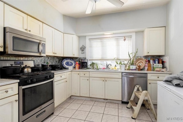 333 Colvin Ave, Buffalo, NY 14216 - kitchen with appliances with stainless steel finishes, light countertops, backsplash, ceiling fan, and a sink