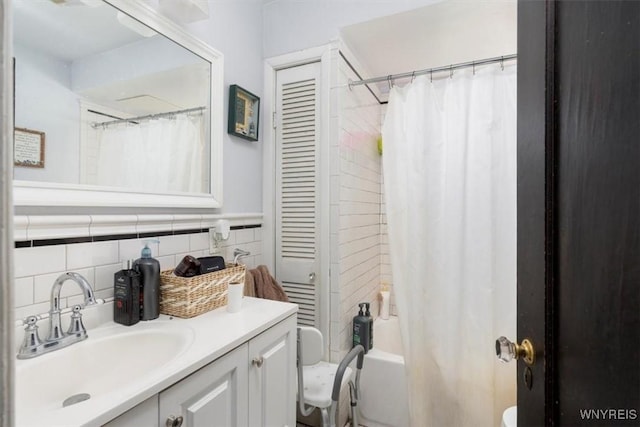 333 Colvin Ave, Buffalo, NY 14216 - bathroom featuring toilet, shower / bath combo with shower curtain, and vanity