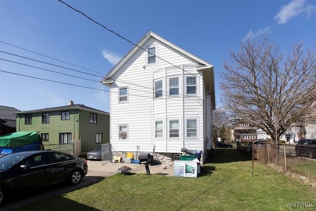 333 Colvin Ave, Buffalo, NY 14216 - rear view of house with fence and a lawn