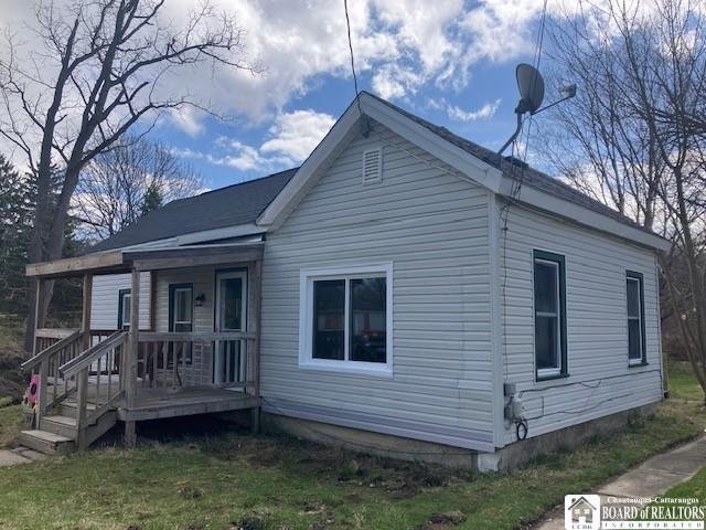59 Pearl St, Hanover, NY 14062 - view of side of property featuring covered porch