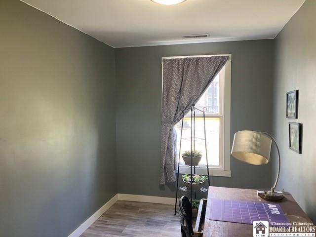 59 Pearl St, Hanover, NY 14062 - office area with visible vents, baseboards, and wood finished floors