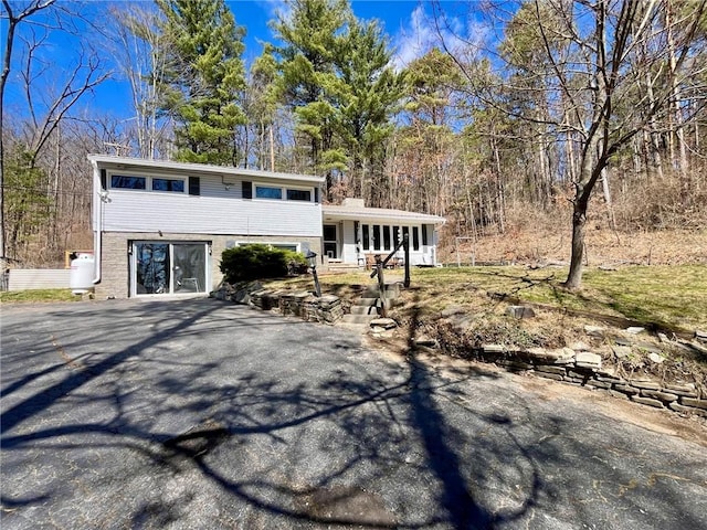 115 Forest Hills Dr, Elmira, NY 14905 - tri-level home featuring a chimney