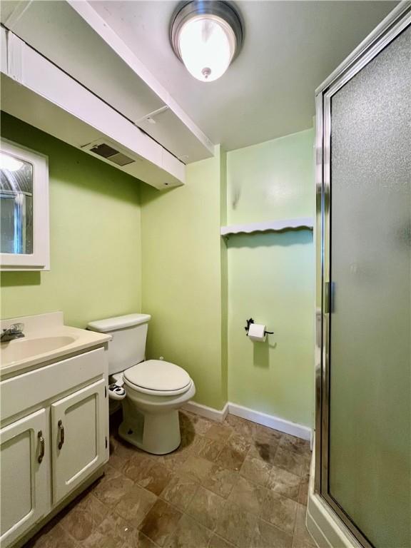 115 Forest Hills Dr, Elmira, NY 14905 - bathroom featuring toilet, a stall shower, visible vents, baseboards, and vanity