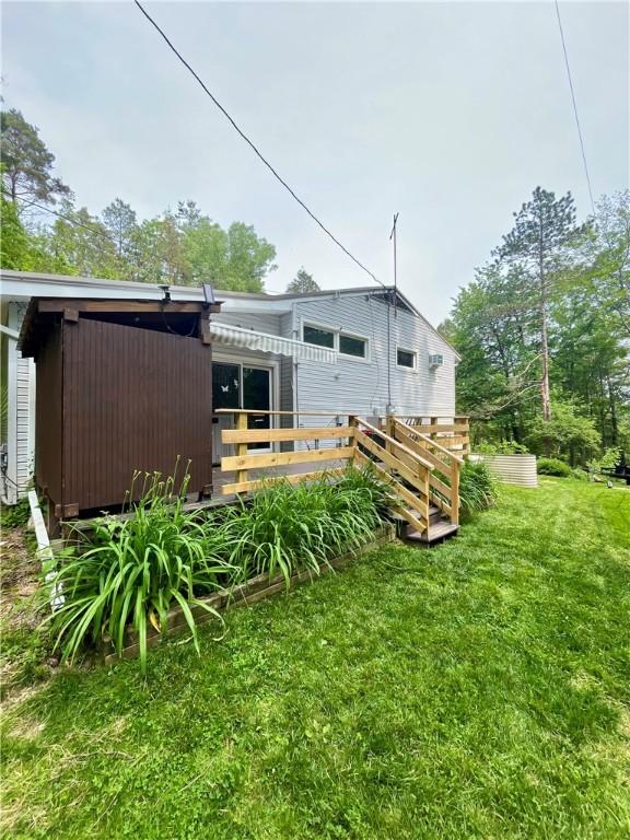 115 Forest Hills Dr, Elmira, NY 14905 - rear view of house featuring a wooden deck and a lawn