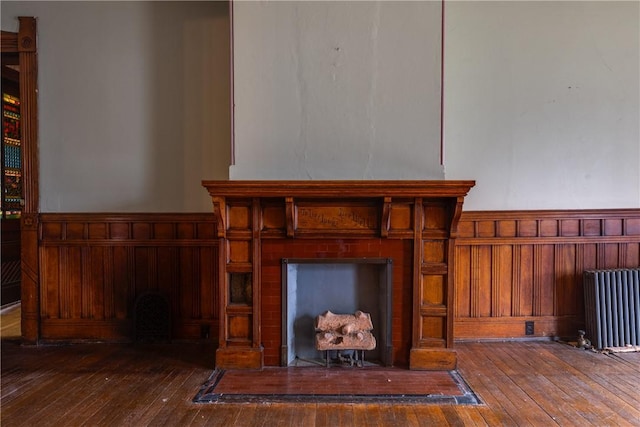24 W 2nd St, Corning-City, NY 14830 - details with a wainscoted wall, radiator heating unit, and wood finished floors