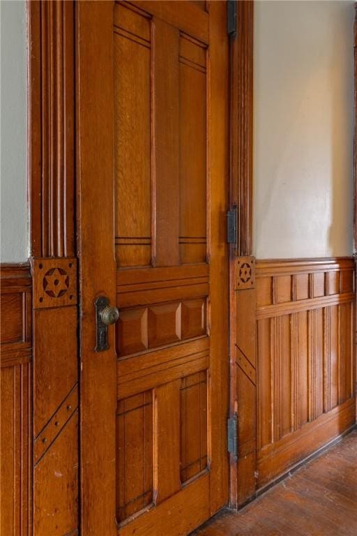 24 W 2nd St, Corning-City, NY 14830 - interior details featuring wood finished floors and a wainscoted wall