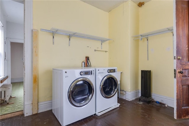 24 W 2nd St, Corning-City, NY 14830 - washroom with laundry area, radiator, dark wood-style flooring, and washer and clothes dryer