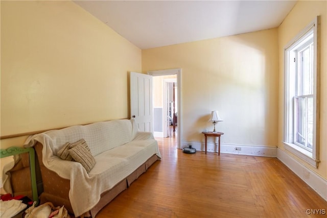 sitting room featuring light wood-type flooring and baseboards