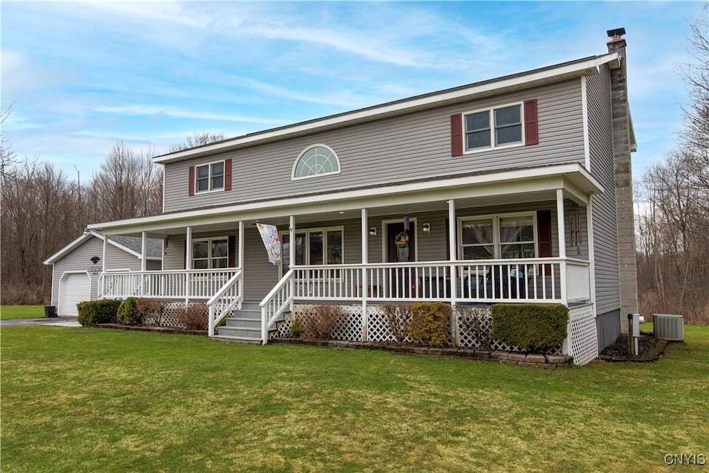 6593 Daily Rd, Westmoreland, NY 13440 - view of front of property featuring a front yard, an attached garage, central AC unit, and covered porch