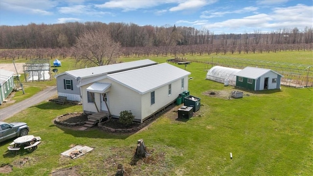 birds eye view of property with a rural view and a forest view