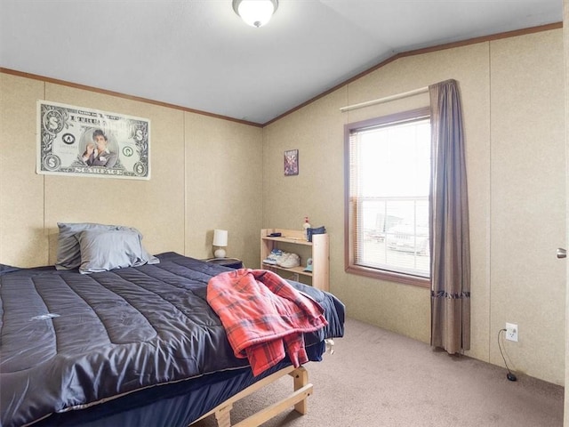 carpeted bedroom featuring crown molding and lofted ceiling